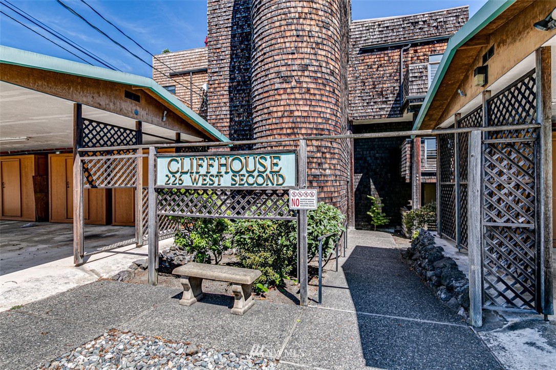 226 West 2nd Street, Unit 2 Port Angeles, WA 98362 - Photo 2 of 40 a view of a patio with table and chairs potted plants