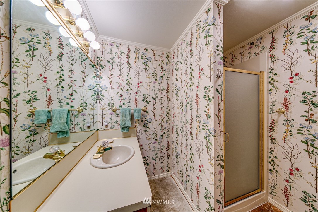 226 West 2nd Street, Unit 2 Port Angeles, WA 98362 - Photo 12 of 40 a bathroom with a sink and a shower curtain