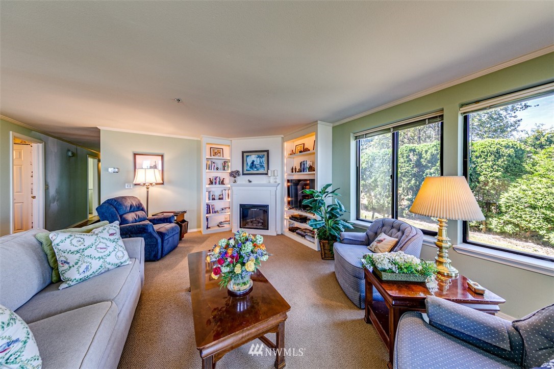 226 West 2nd Street, Unit 2 Port Angeles, WA 98362 - Photo 23 of 40 a living room with furniture and a large window