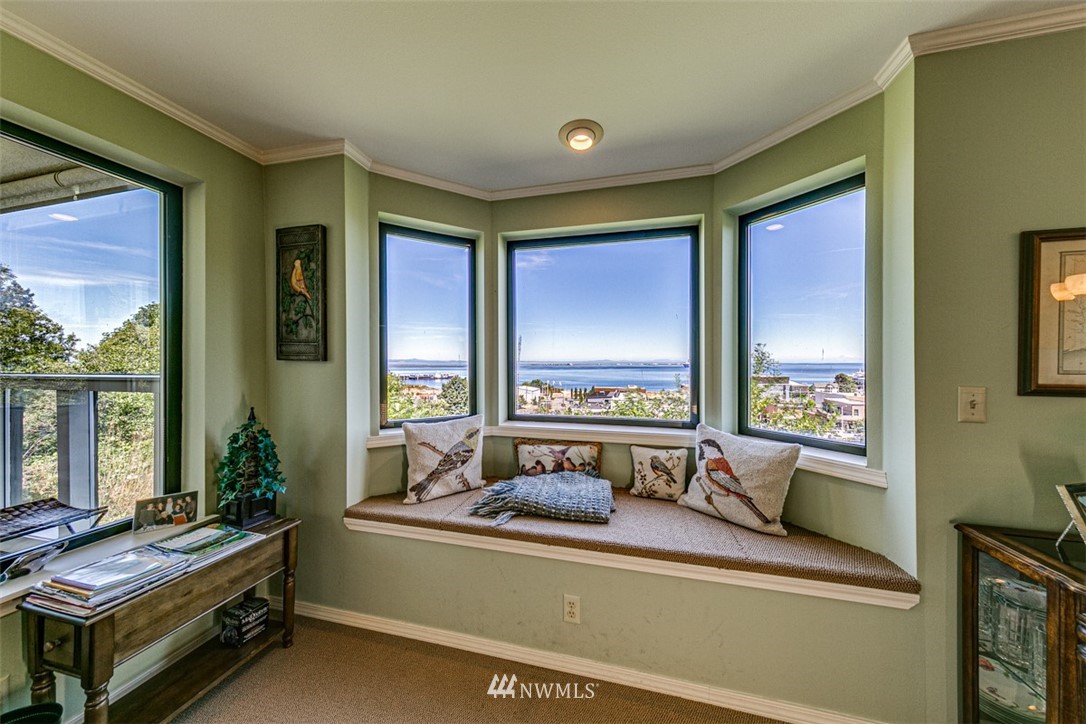 226 West 2nd Street, Unit 2 Port Angeles, WA 98362 - Photo 28 of 40 a bedroom with furniture and a large window