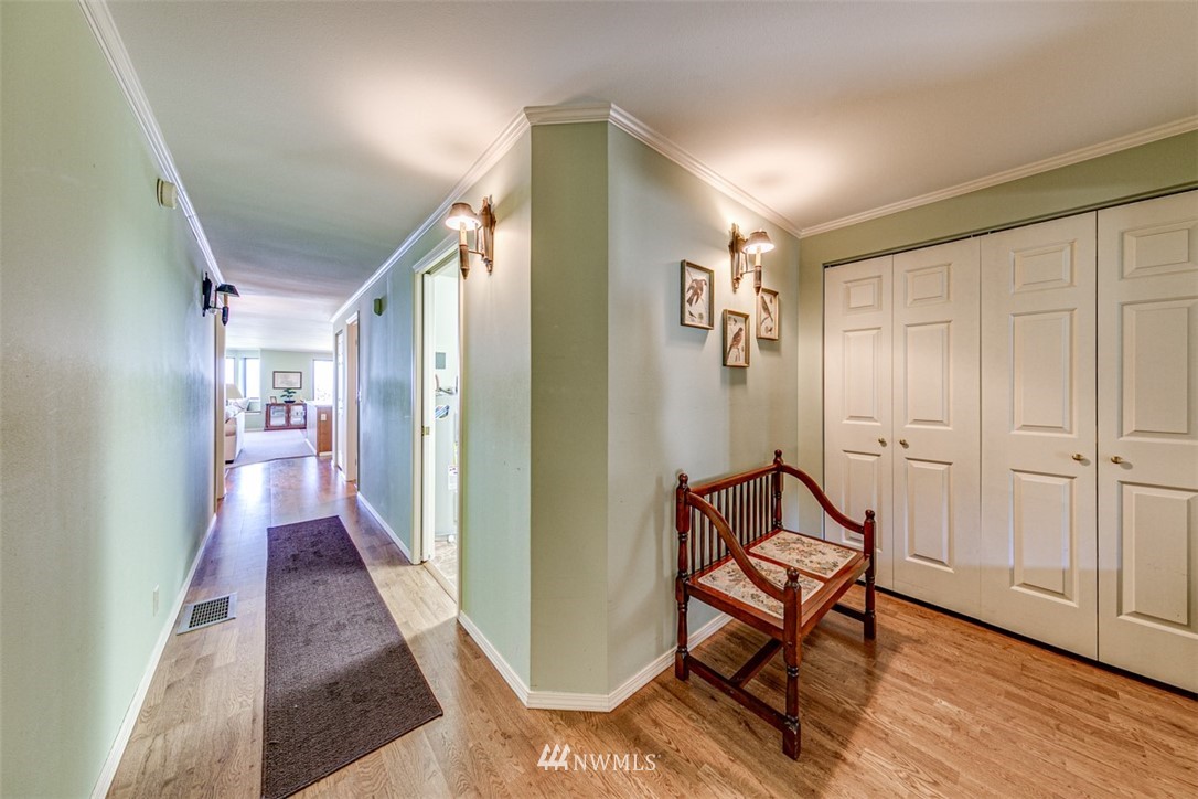 226 West 2nd Street, Unit 2 Port Angeles, WA 98362 - Photo 5 of 40 a view of a hallway with wooden floor and staircase