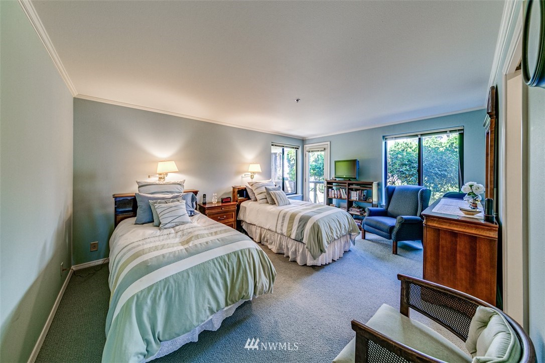 226 West 2nd Street, Unit 2 Port Angeles, WA 98362 - Photo 6 of 40 a bedroom with bed and a large window