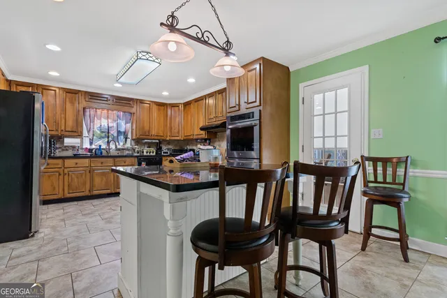 a view of a dining room with furniture and a window
