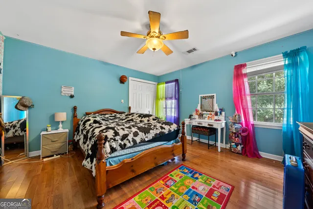 a view of a bedroom with a flat screen tv