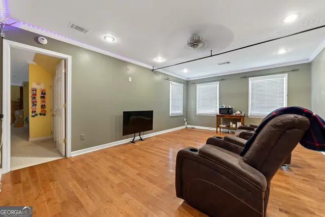 a bedroom with furniture and a chandelier