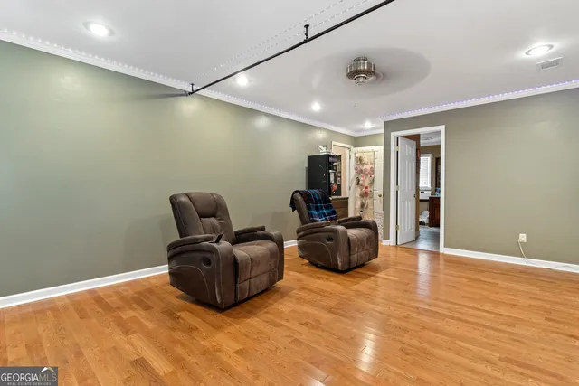 a bedroom with a bed a dresser and a window