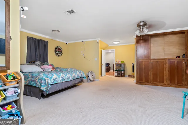 a view of house with backyard and outdoor seating