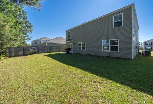 a view of a lake with houses in the back