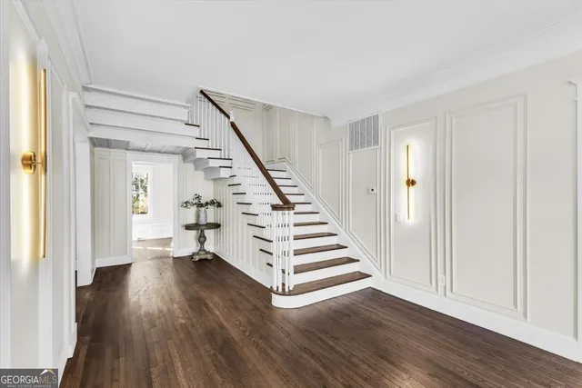 a living room with furniture large window and a fireplace