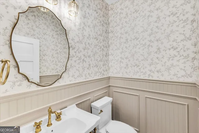 a kitchen with a refrigerator and a sink