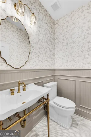 a dining room with furniture a rug and wooden floor