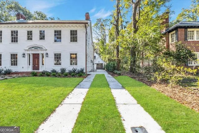 a front view of a house with a yard
