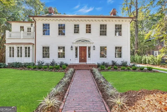 front view of a house with a yard