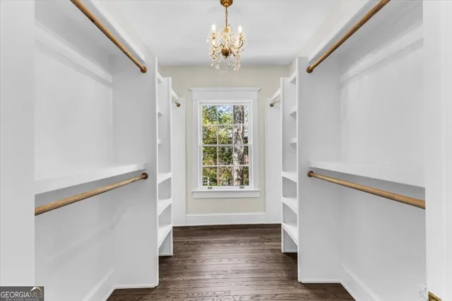 a kitchen with granite countertop a sink stove and cabinets