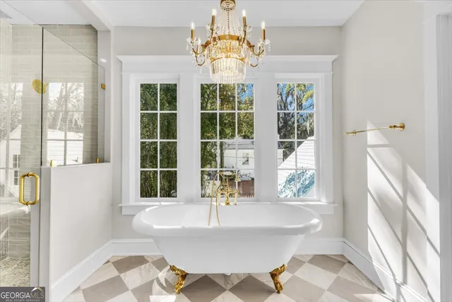 a kitchen with cabinets stainless steel appliances and a window