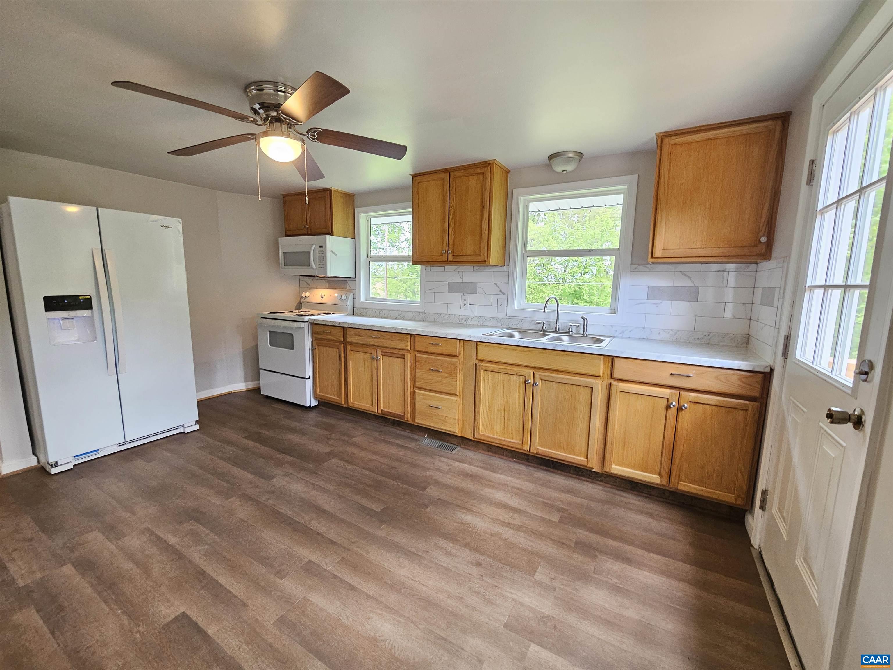 5290 Dixie Hill Road Buckingham, VA 23921 - Photo 10 of 24 a view of a kitchen with a sink cabinet and a window