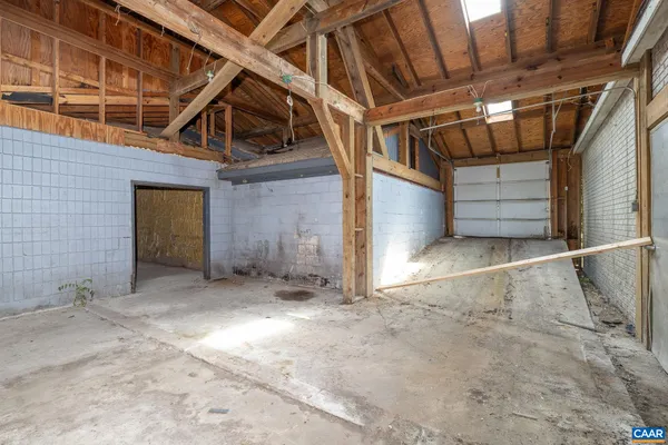 a view of a room with wooden floor and windows