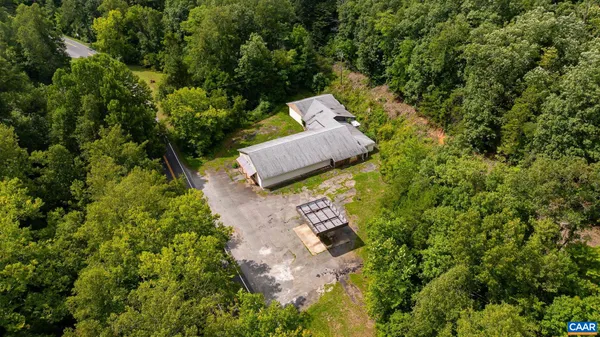 a aerial view of a house with a yard