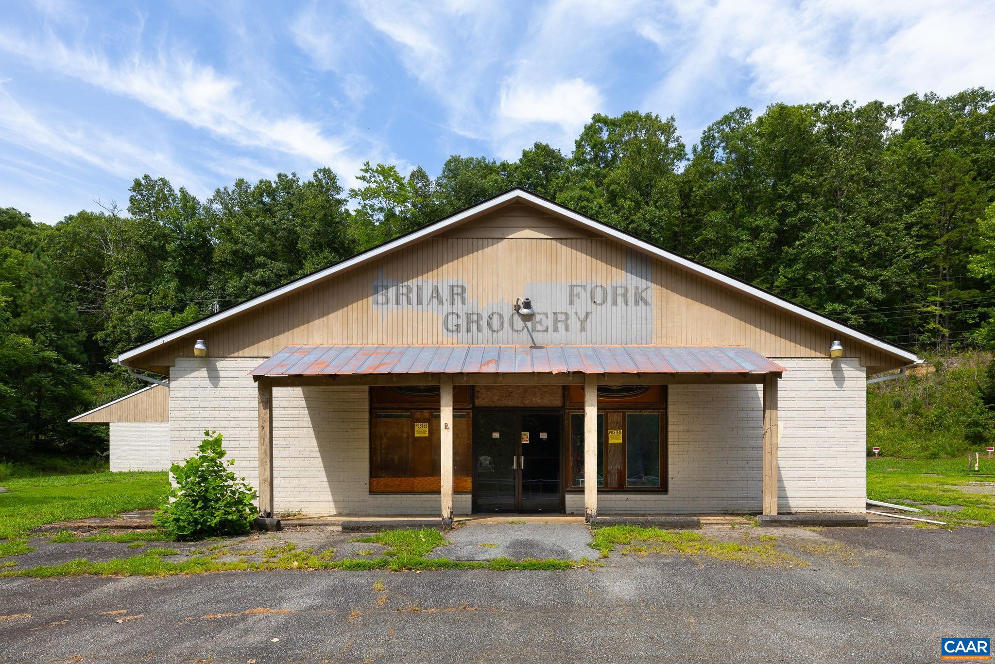 4952 Irish Road Schuyler, VA 22969 - Photo 4 of 33 a front view of a house with a garden and plants