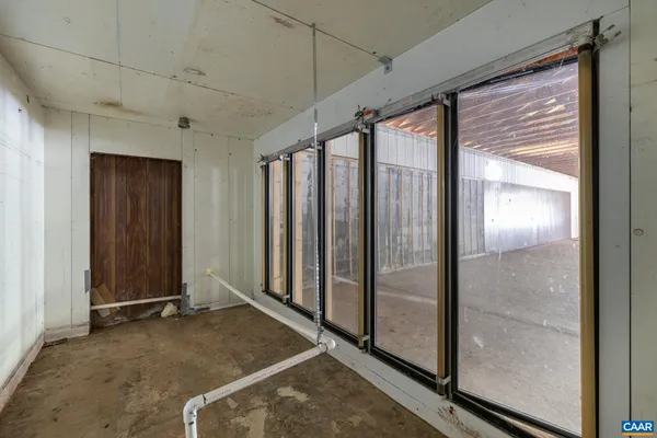 a view of a room with wooden walls