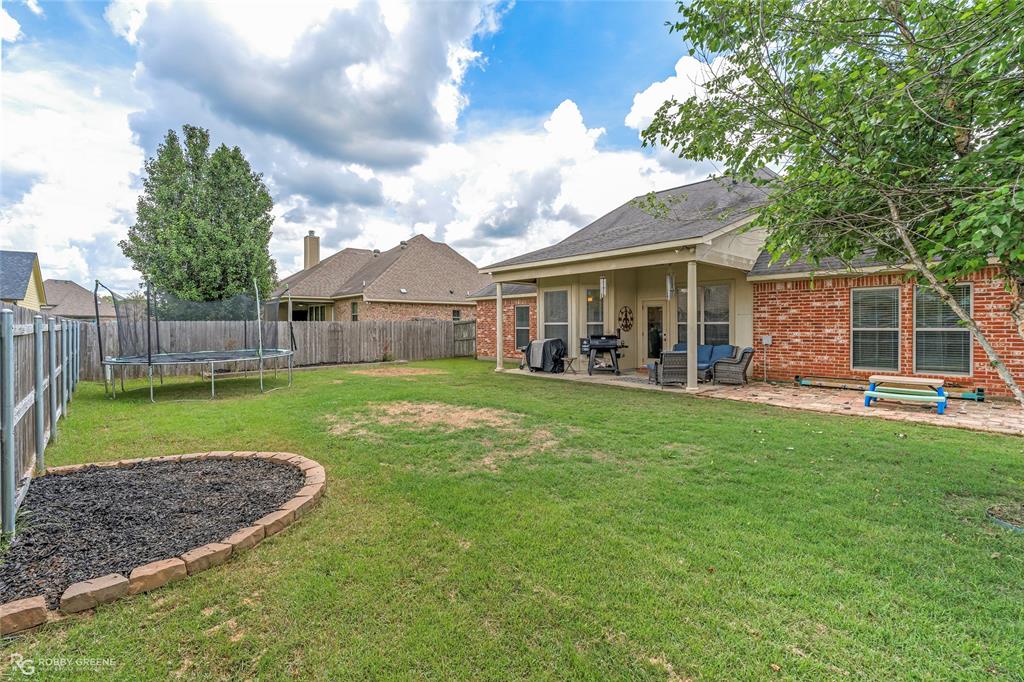 711 Reeds Reef Bossier City, LA 71112 - Photo 33 of 36 a view of a house with a backyard