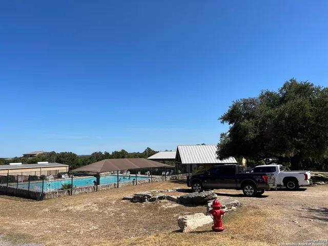 a view of outdoor space with swimming pool and furniture