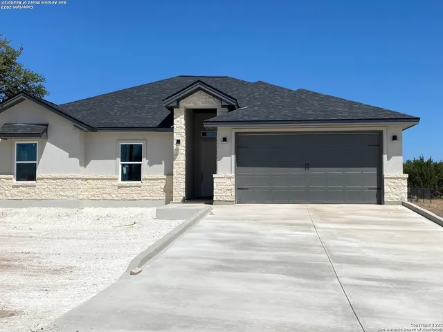 a front view of a house with a outdoor space