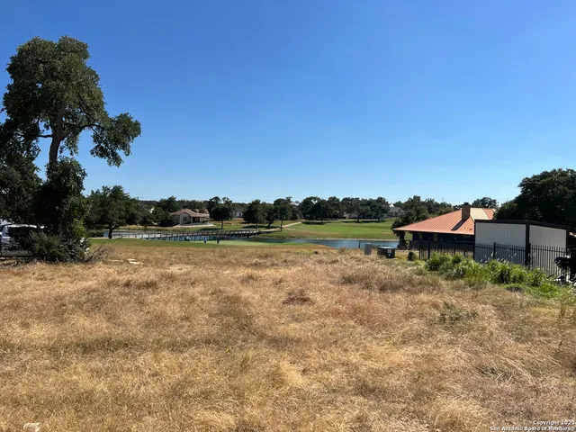 a view of swimming pool with a yard