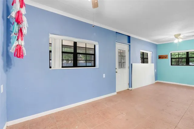 a view of a big room with windows