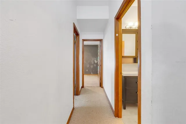 a view of a bathroom from a hallway