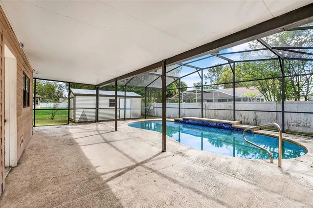 a view of a backyard of the house
