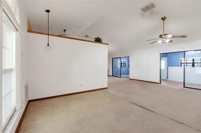 a view of an empty room with a window