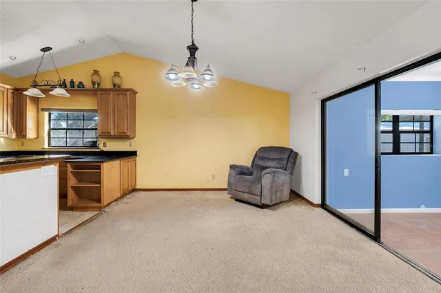 a kitchen with granite countertop a stove and a sink