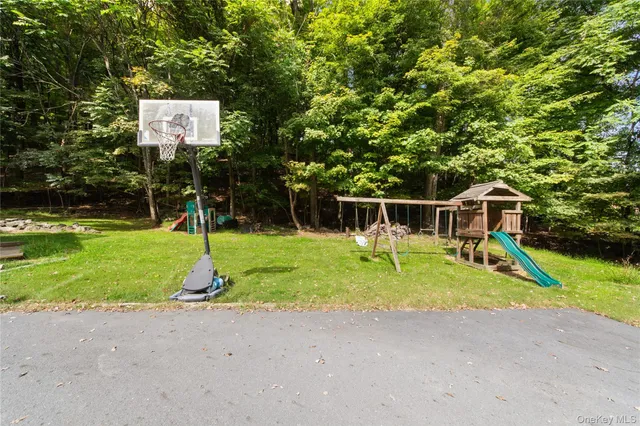 a house with swimming pool in front of it