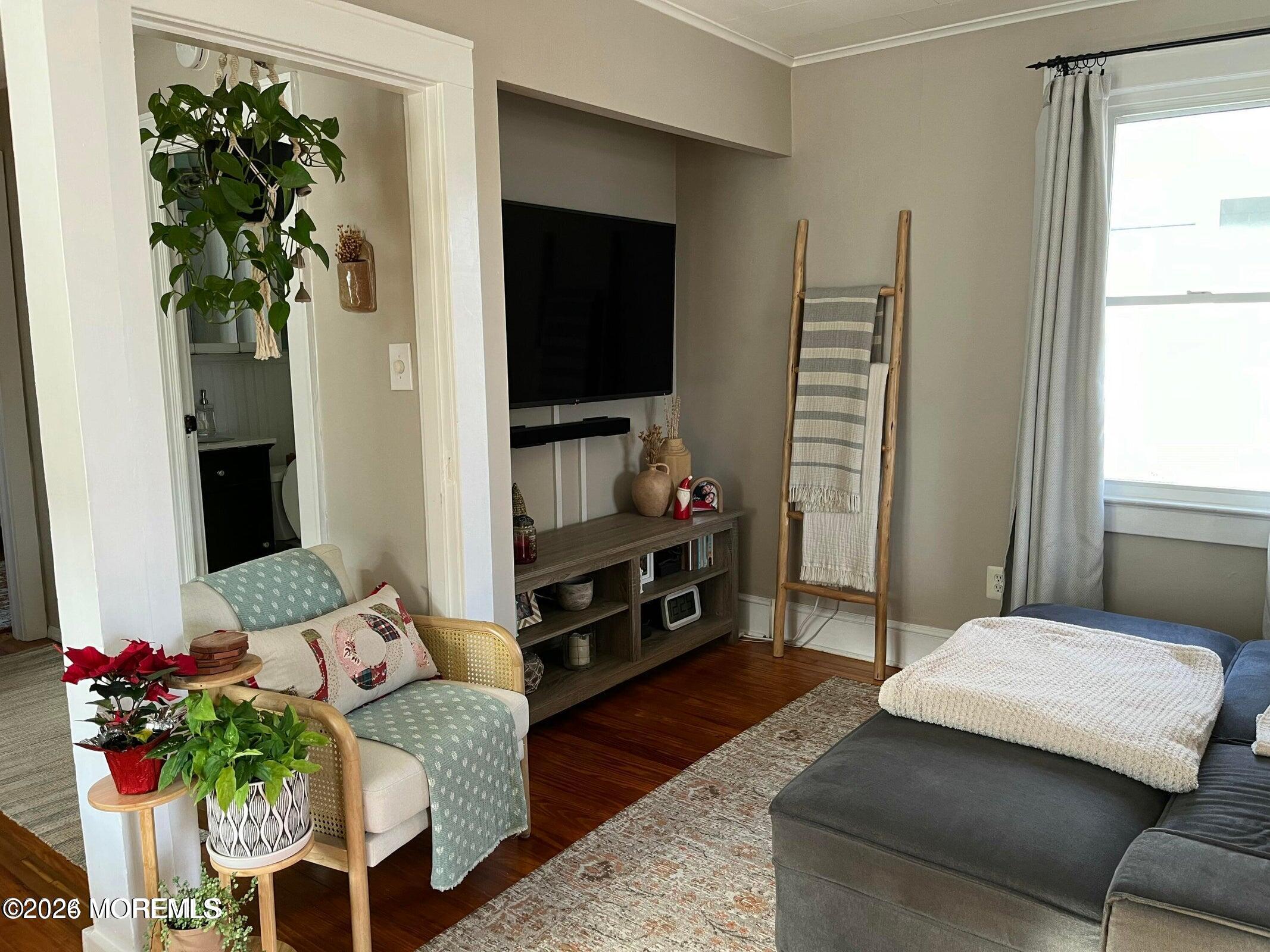 1236 Maplewood Road Belmar, NJ 07719 - Photo 11 of 44 a living room with furniture and a flat screen tv