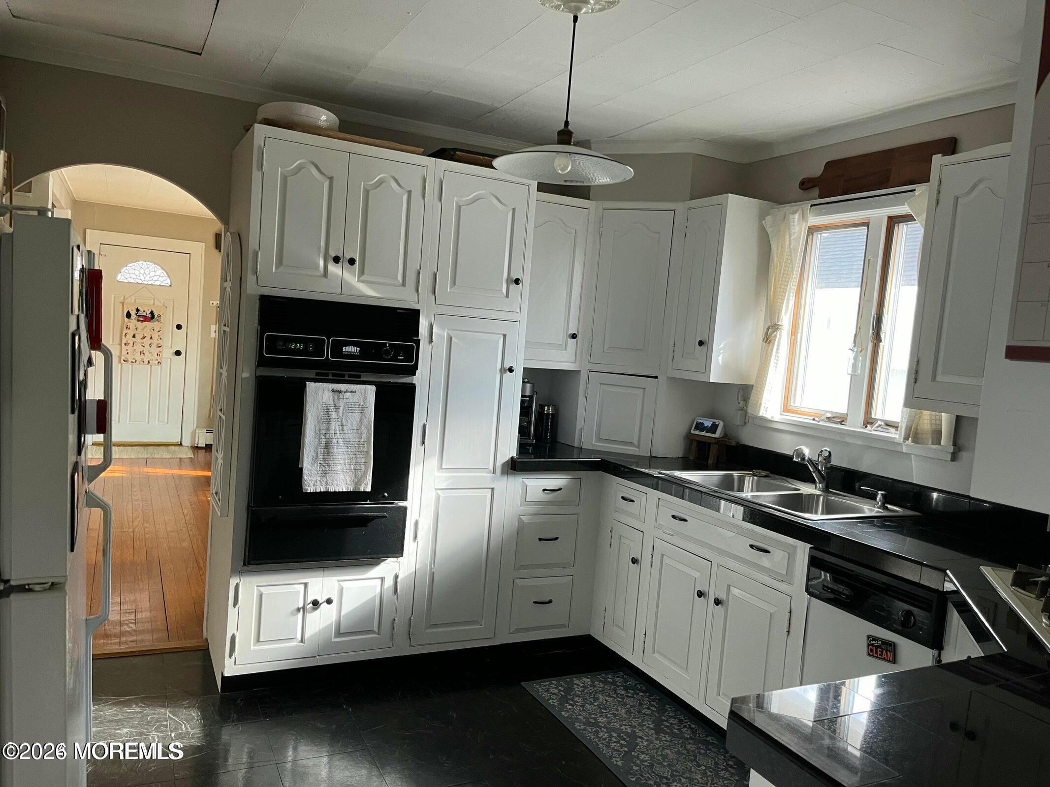 1236 Maplewood Road Belmar, NJ 07719 - Photo 15 of 44 a kitchen with a sink and cabinets