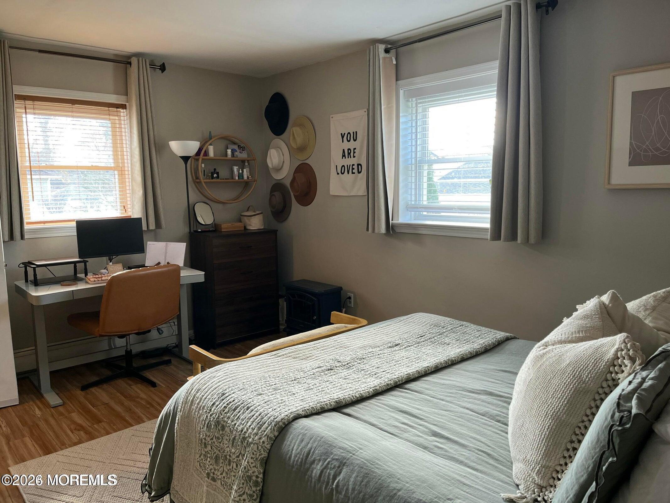 1236 Maplewood Road Belmar, NJ 07719 - Photo 25 of 44 a bedroom with a bed and a window