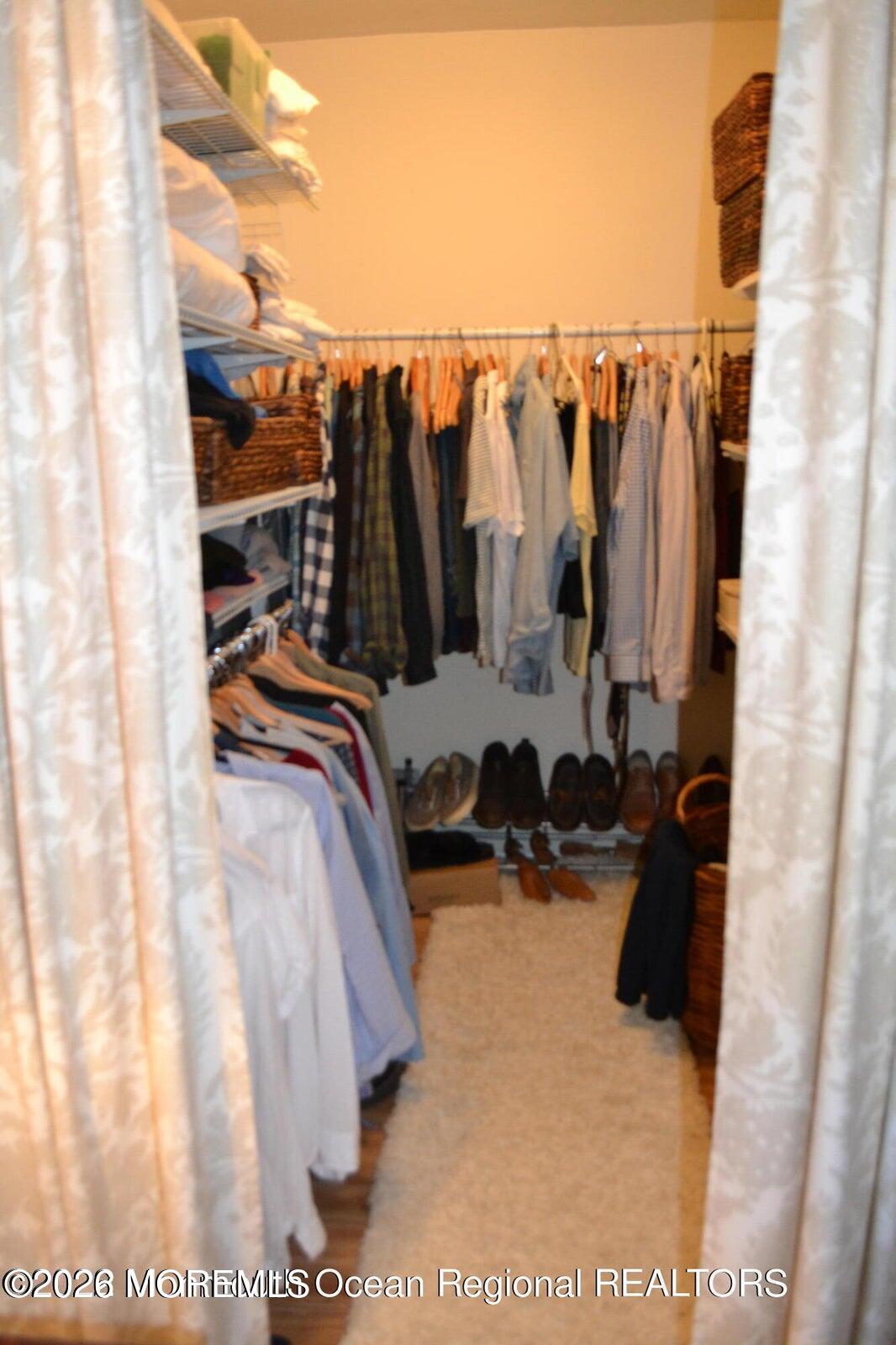 1236 Maplewood Road Belmar, NJ 07719 - Photo 26 of 44 a view of walk in closet with clothes and shoes