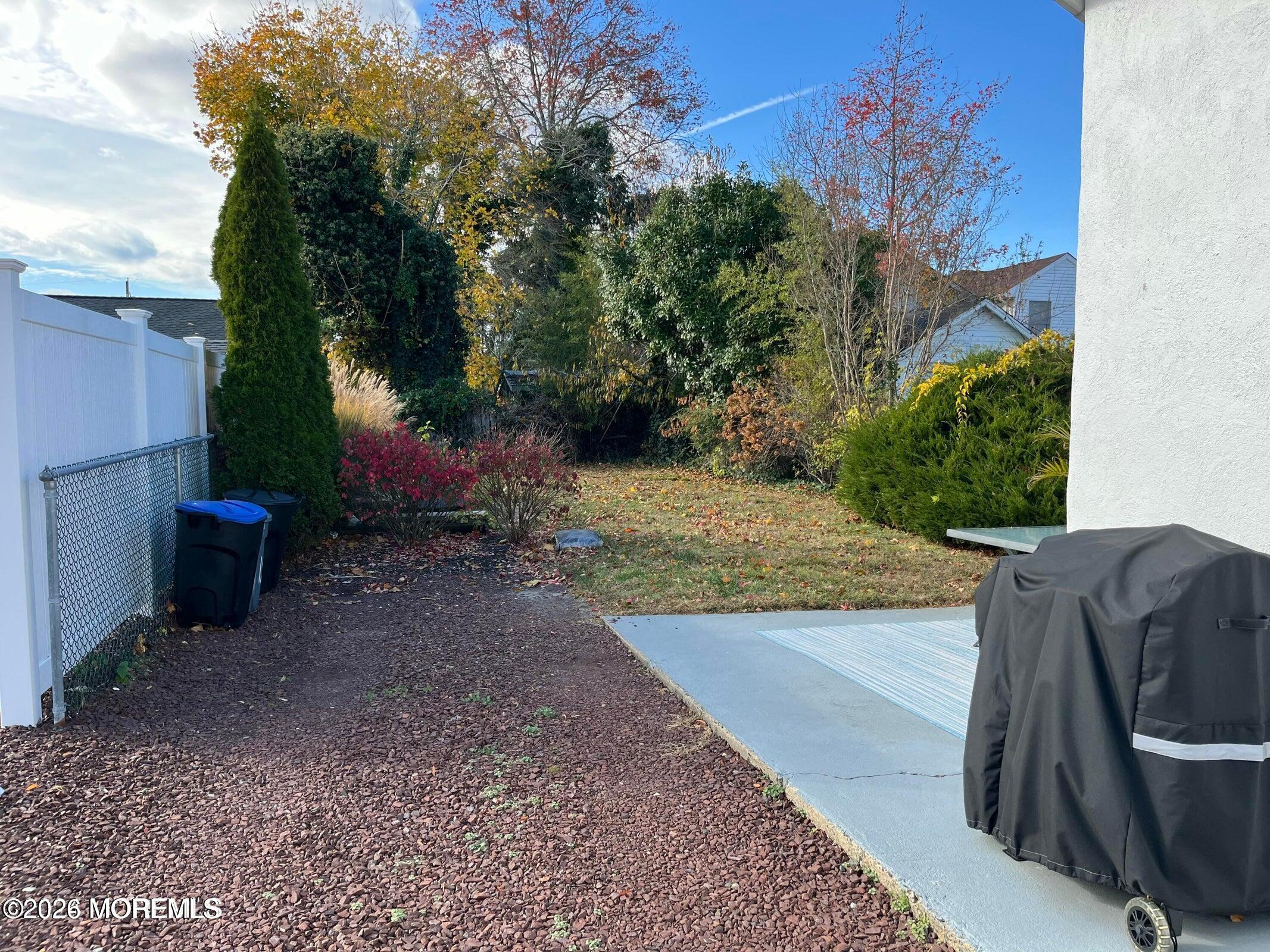 1236 Maplewood Road Belmar, NJ 07719 - Photo 35 of 44 a view of a backyard with plants and trees