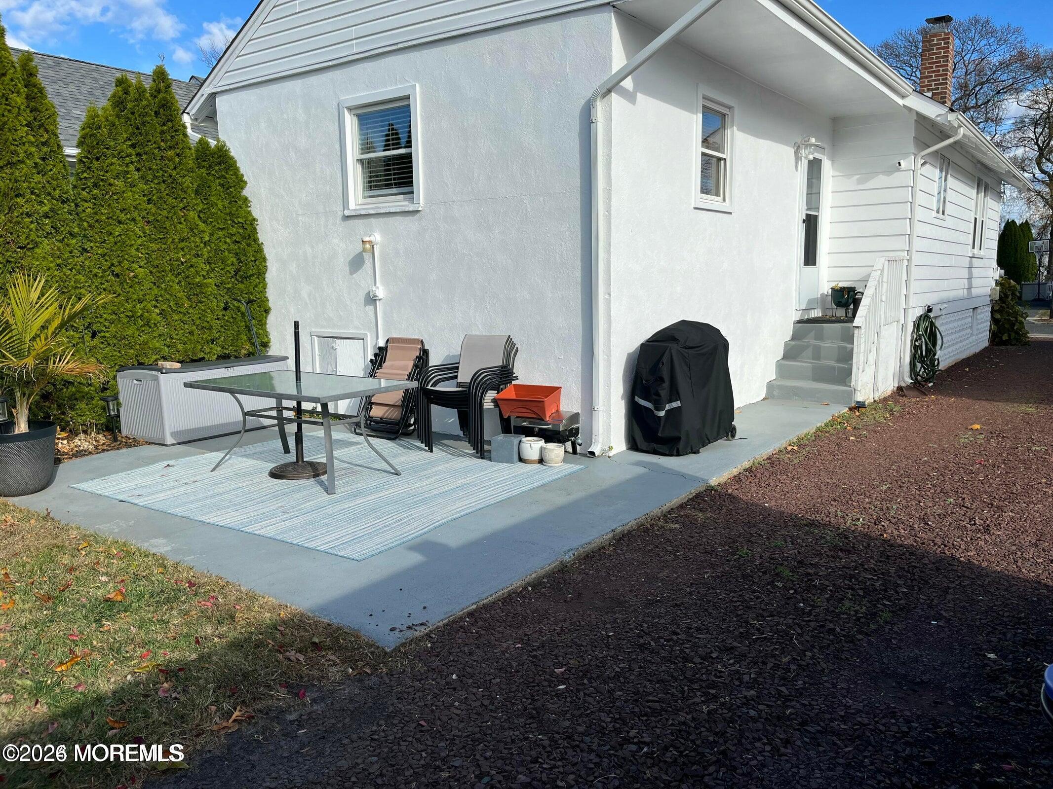 1236 Maplewood Road Belmar, NJ 07719 - Photo 38 of 44 a view of a patio with couches and a fireplace