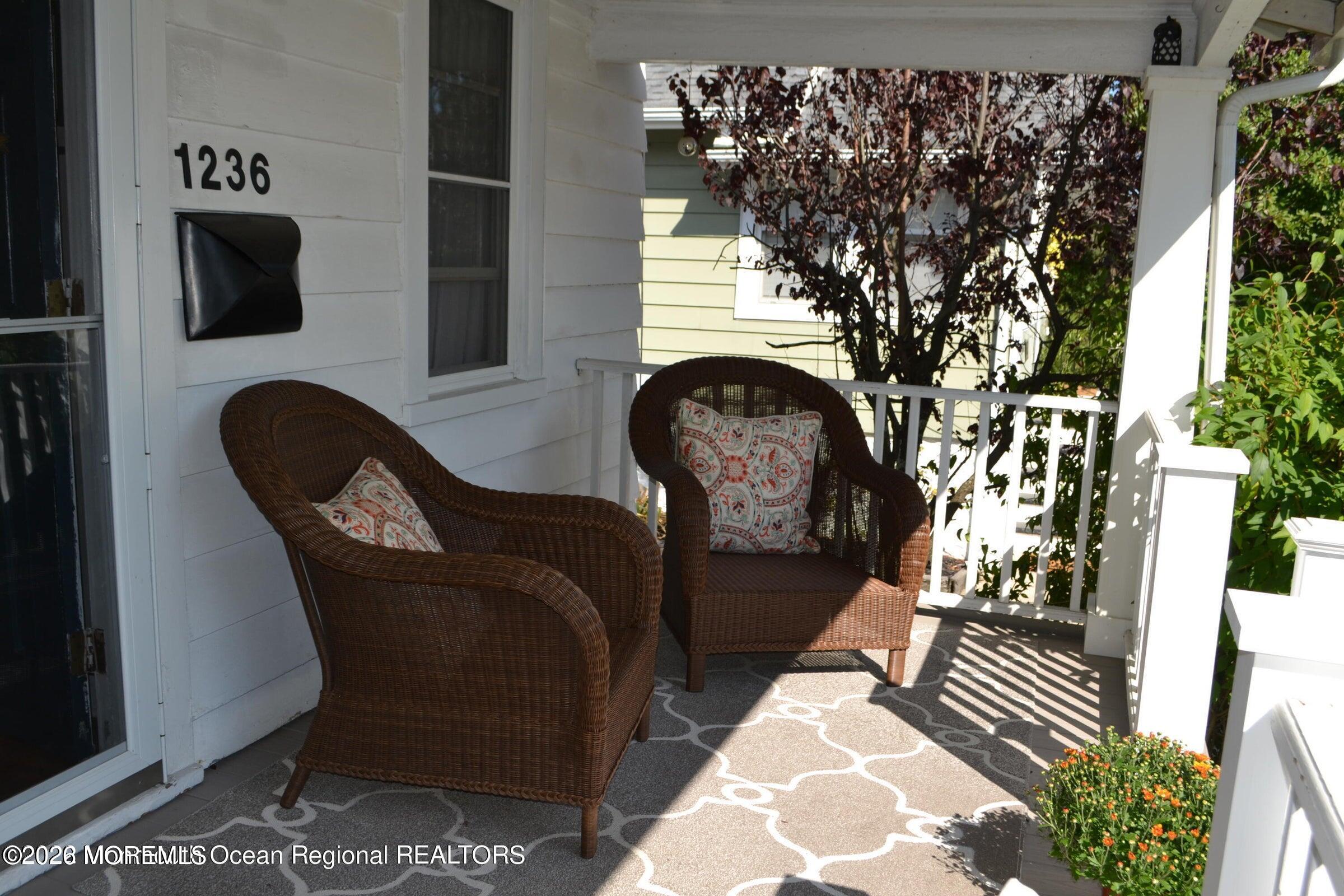 1236 Maplewood Road Belmar, NJ 07719 - Photo 5 of 44 a living room with furniture and a fireplace