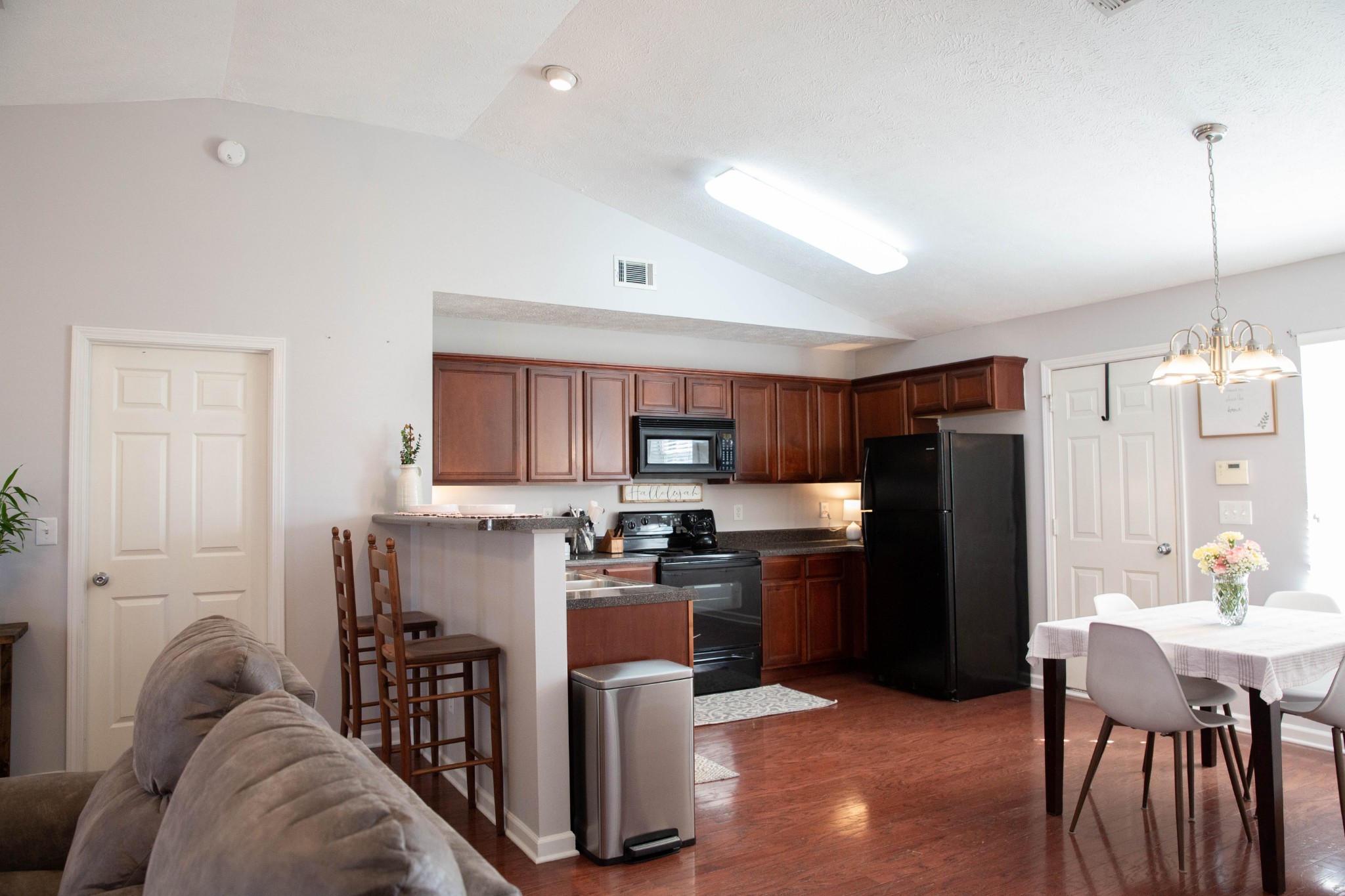 1880 Portway Road Spring Hill, TN 37174 - Photo 8 of 29 a kitchen with kitchen island a refrigerator and a wooden cabinets