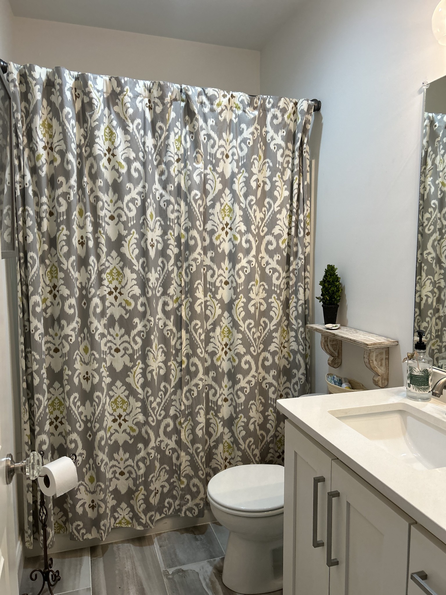 207 North Walnut Street Springfield, TN 37172 - Photo 12 of 14 a bathroom with a granite countertop sink and a toilet