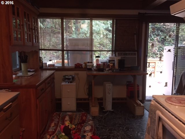 64437 East Barlow Trail Road Rhododendron, OR 97049 - Photo 5 of 15 a dining room with a window and chairs