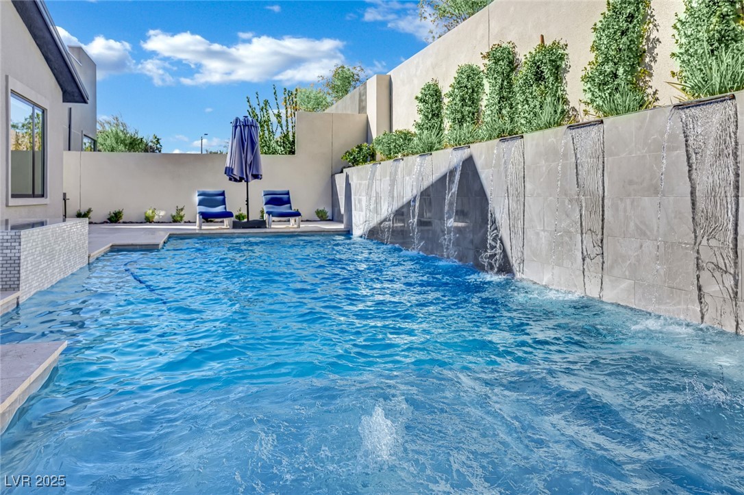 397 Highview Rdg Avenue Las Vegas, NV 89138 - Photo 14 of 97 View of pool with a patio and a fenced backyard