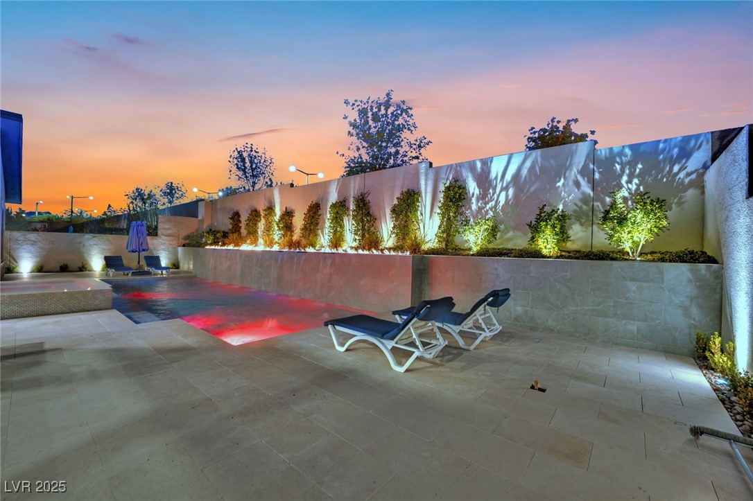 397 Highview Rdg Avenue Las Vegas, NV 89138 - Photo 15 of 97 Patio terrace at dusk featuring a patio