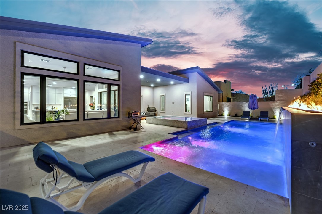 397 Highview Rdg Avenue Las Vegas, NV 89138 - Photo 16 of 97 View of swimming pool featuring a patio, a fenced backyard, and a pool with connected hot tub