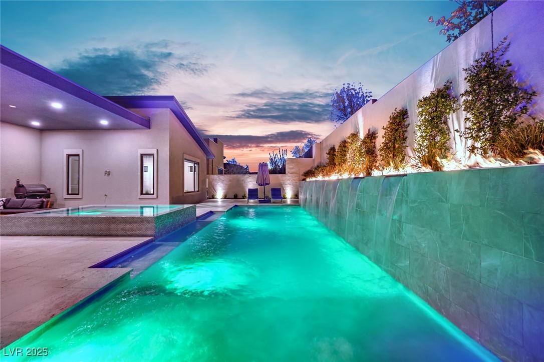 397 Highview Rdg Avenue Las Vegas, NV 89138 - Photo 18 of 97 Pool at dusk featuring a patio area and a fenced backyard