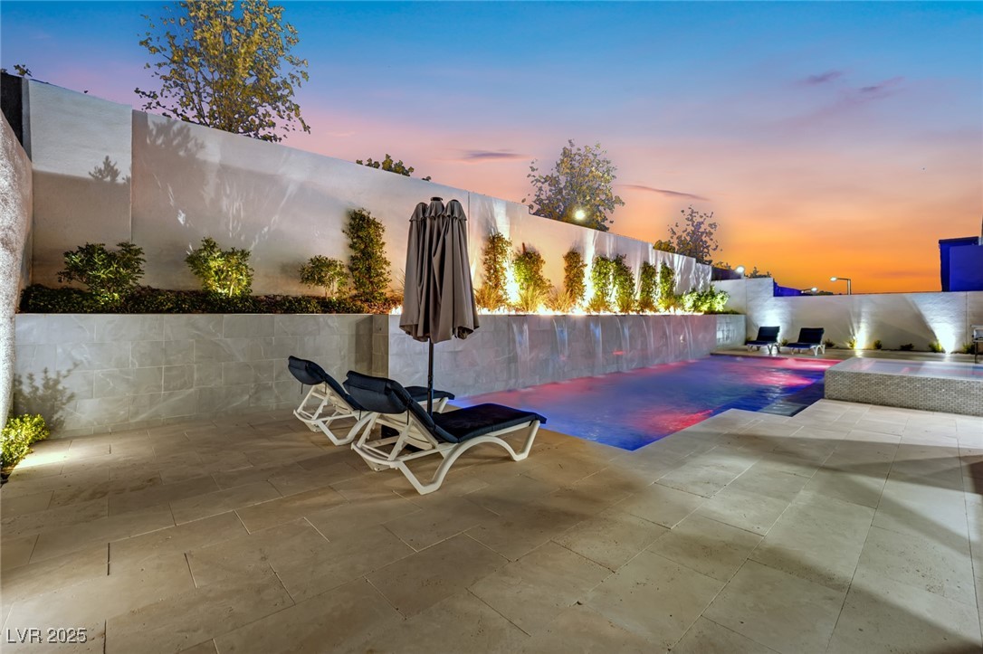 397 Highview Rdg Avenue Las Vegas, NV 89138 - Photo 21 of 97 Fenced backyard featuring a pool with connected hot tub and a patio