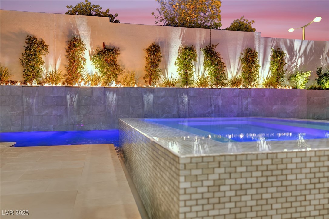 397 Highview Rdg Avenue Las Vegas, NV 89138 - Photo 26 of 97 Pool at dusk with a patio and a fenced backyard